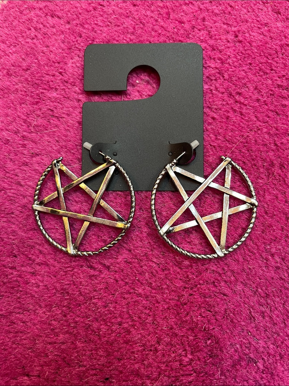 Silver tone pentagram hoop earrings